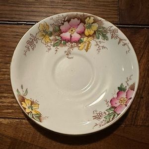 Adderley china saucer with pink and yellow flowers.